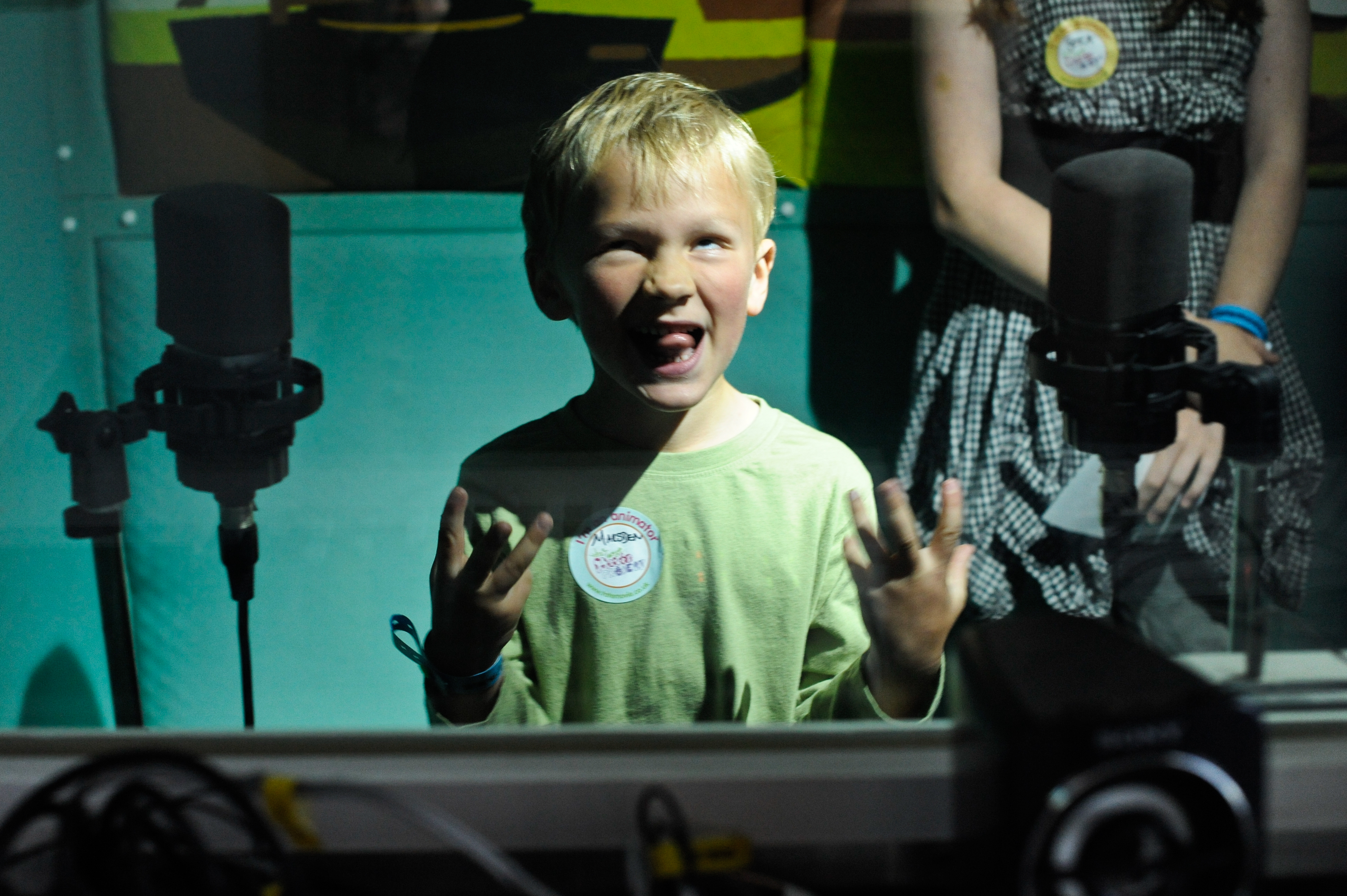 Boy in front of microphones